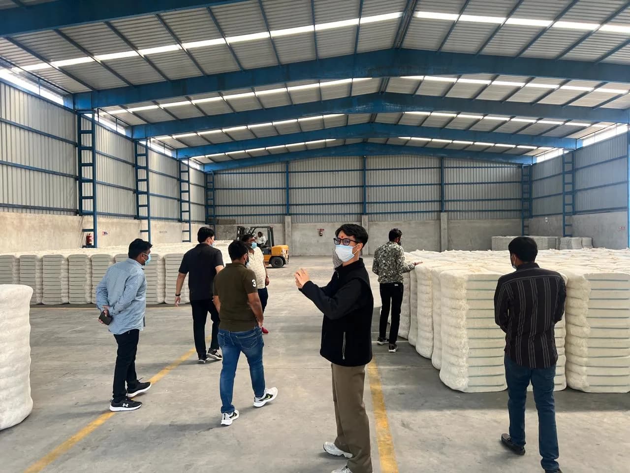 Client delegation touring the cotton bale warehouse