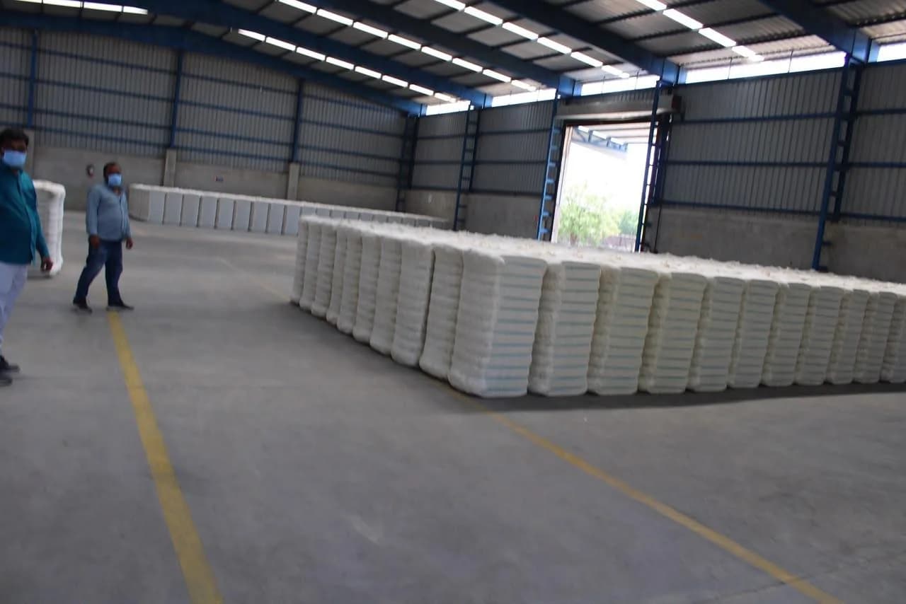 Cotton bales arranged in a large warehouse